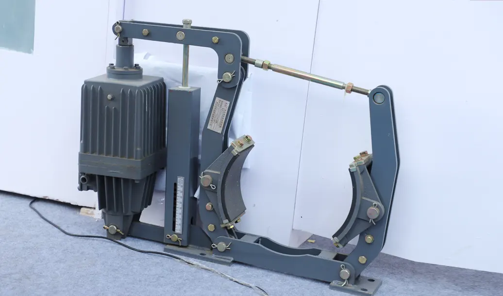 Hydraulic hoist brake assembly for tower crane lifting system